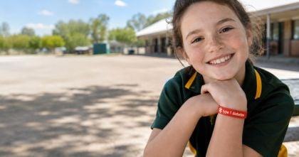 Australian school child wearing a silicone medical alert bracelet for kids