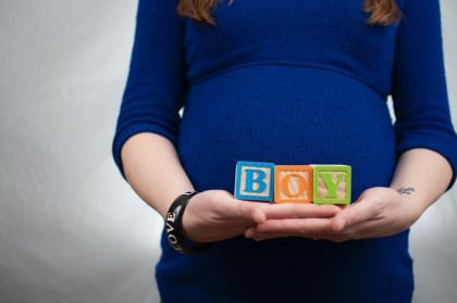 Pregnant woman relaxing outdoors — pregnancy safety tips and medical alert bracelet Australia