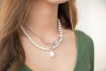 Woman checking thyroid gland in neck — thyroid disease awareness and medical alert bracelet Australia