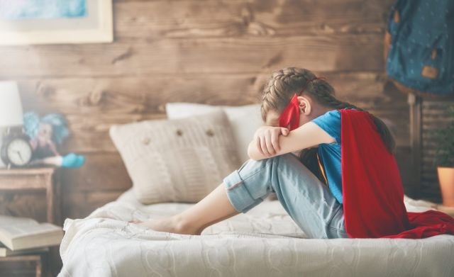 Young child in superhero costume — every autistic child deserves a safety net