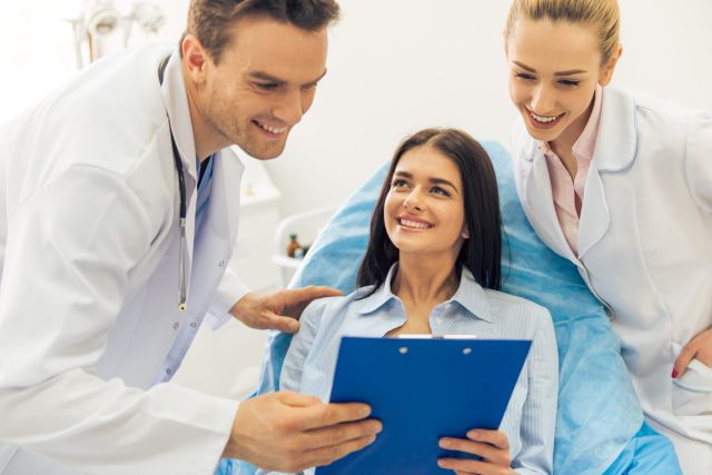 Person managing health records with medical wallet card