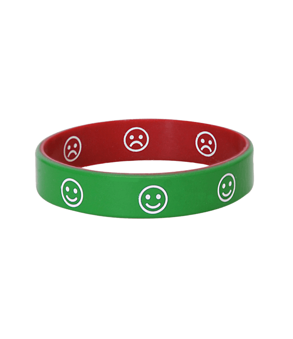Mediband Emotion Bracelet &mdash; reversible silicone band with smiling green face on one side and frowning red face on the other, used as a classroom communication tool