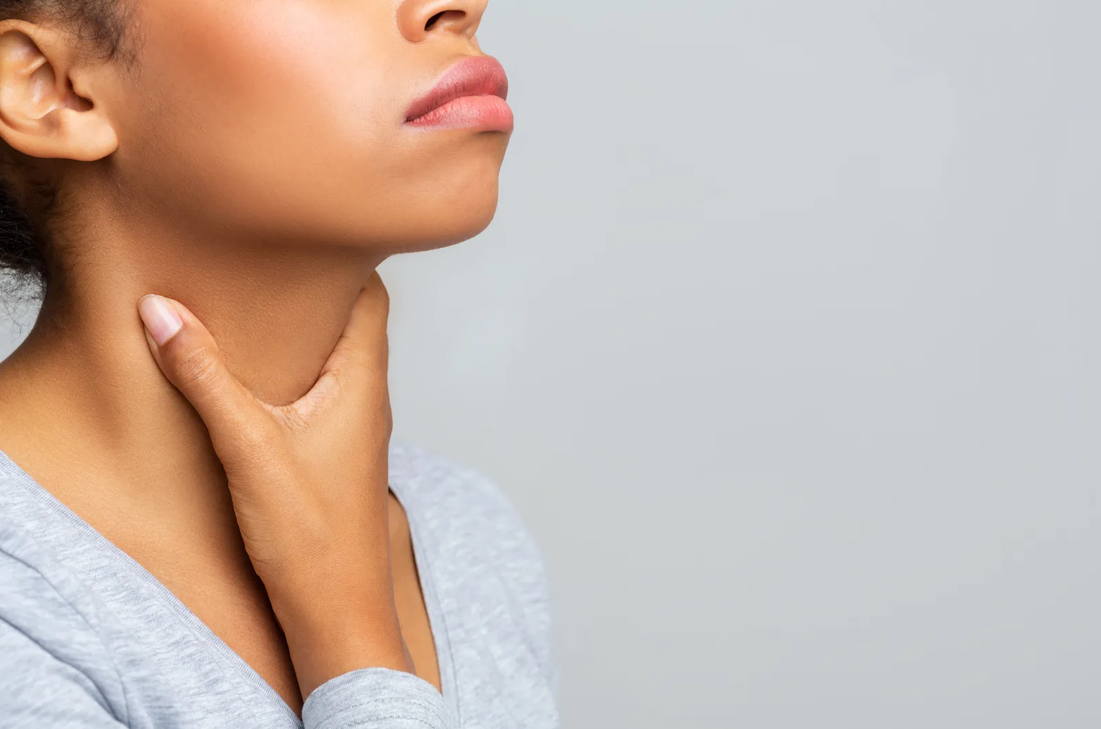 Person checking swollen lymph nodes — when to see a doctor