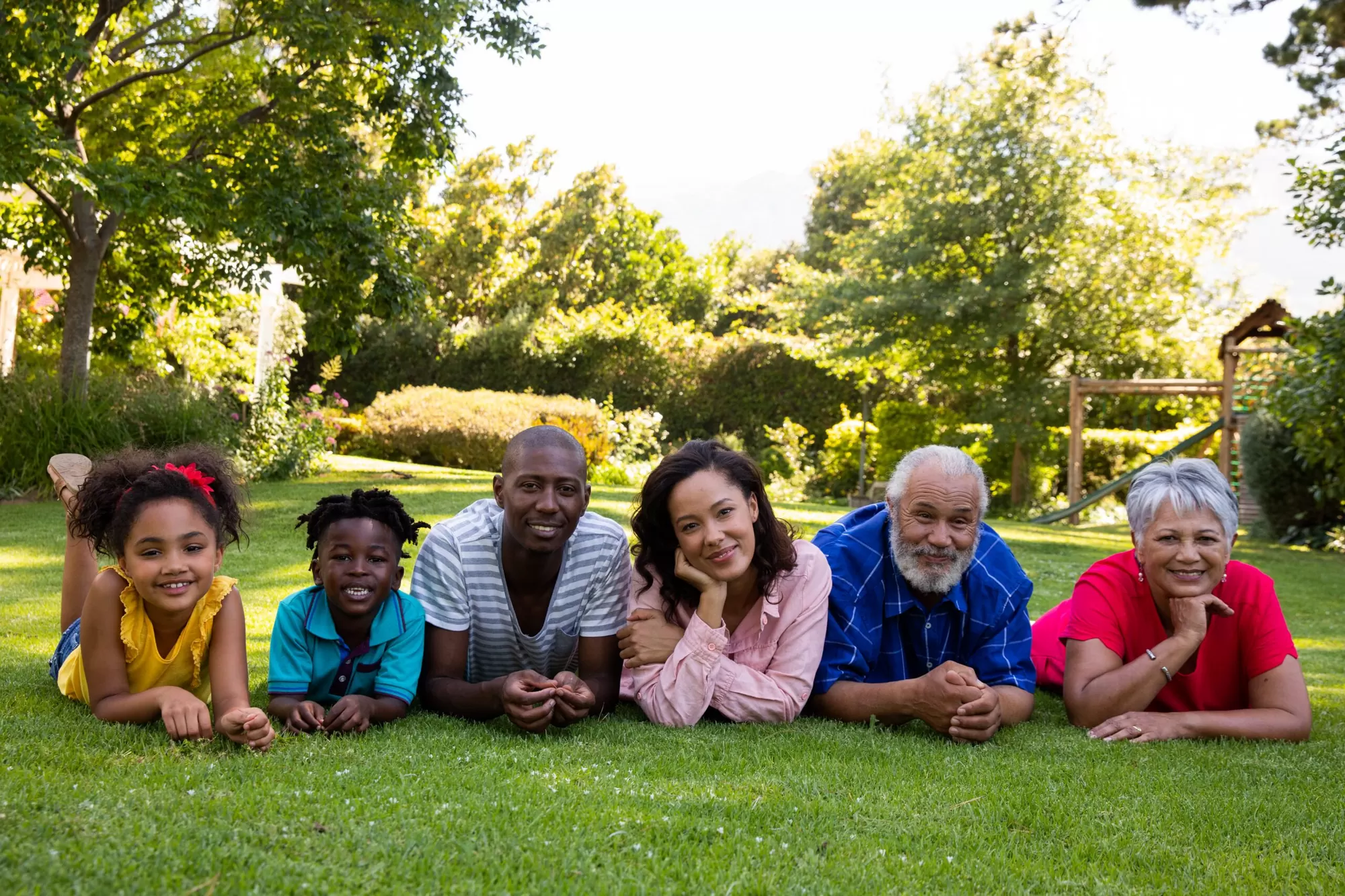 Family sitting in the garden talking openly about chronic illness