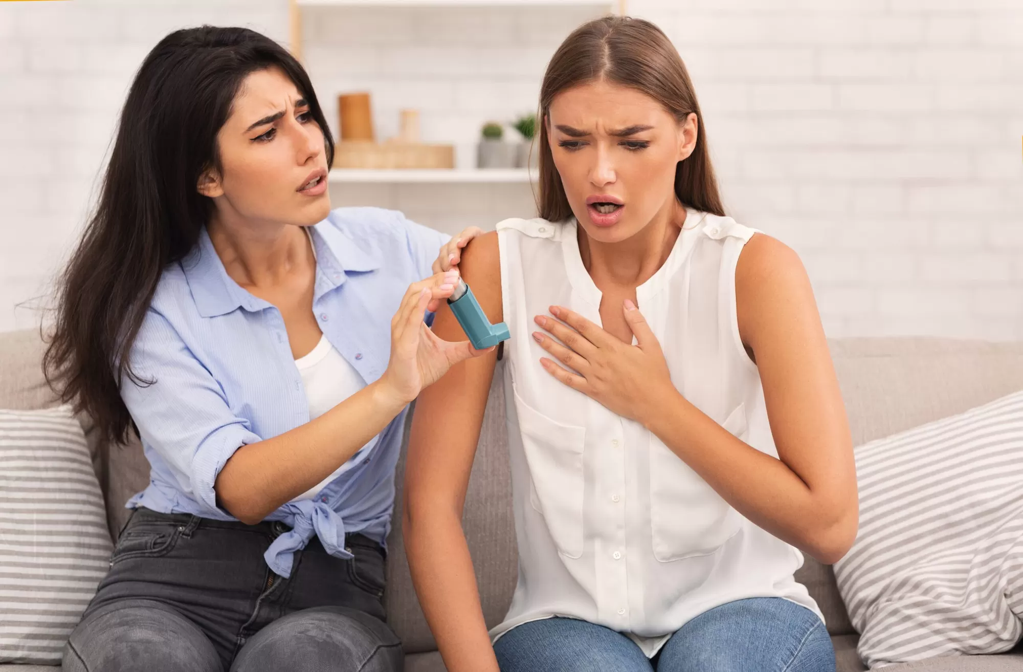 Friend supporting another with an asthma inhaler — peer support matters