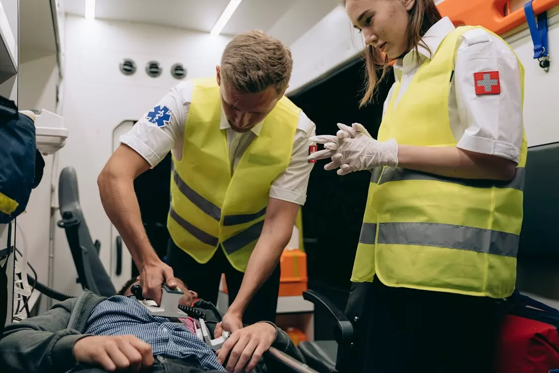 Paramedics treating a patient — Mediband speaks for the wearer in emergencies