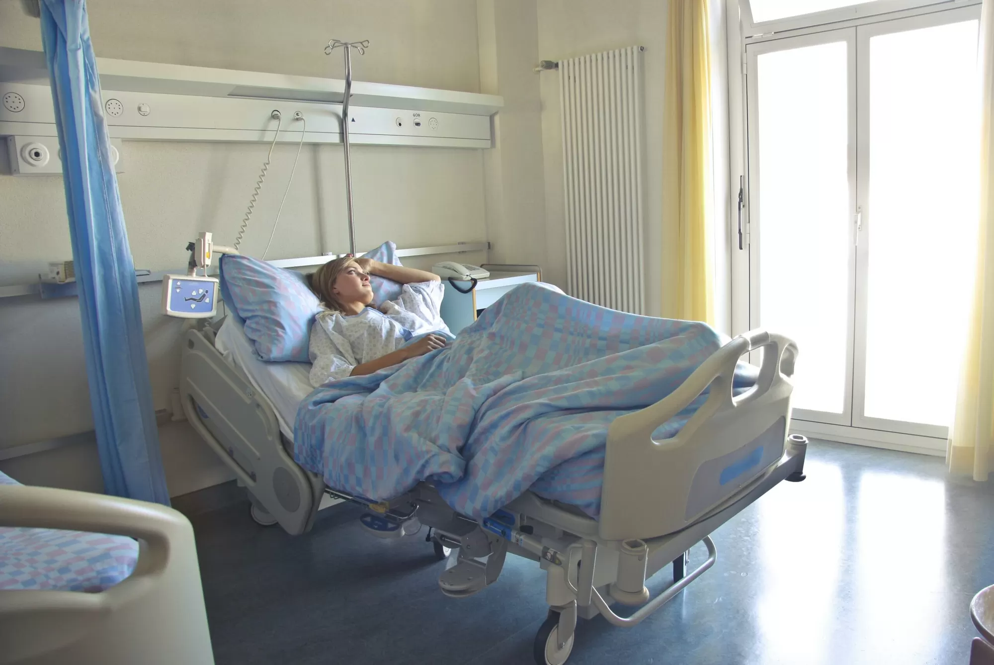 Person preparing for a hospital stay with medical alert bracelet — hospital bag checklist