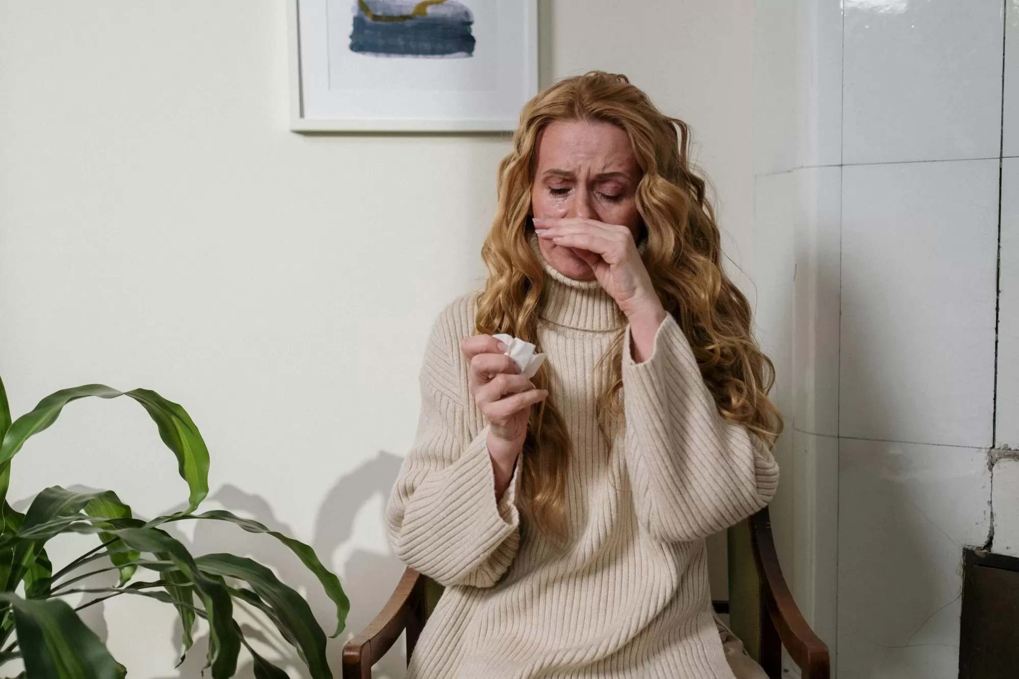 Person holding an EpiPen adrenaline autoinjector for anaphylaxis emergency treatment