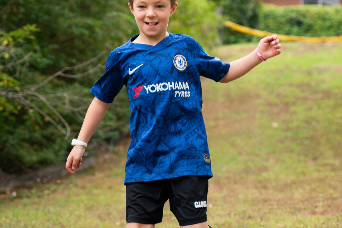 A young Australian wearing a Mediband on the wrist — the same medical ID that works for older Australians works for kids playing sport