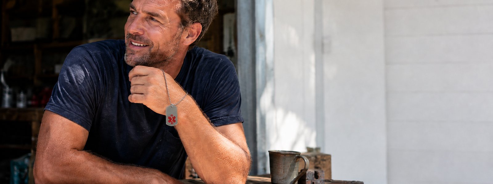 Man wearing a stainless steel medical alert bracelet for men
