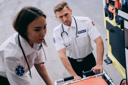 EMS first responder running with stretcher — medical alert bracelets save lives in emergencies