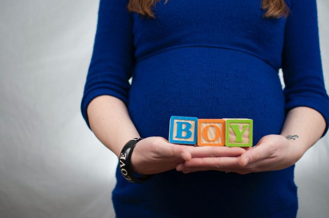 Pregnant woman relaxing outdoors — pregnancy safety tips and medical alert bracelet Australia