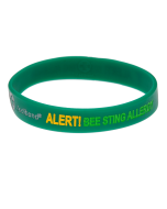 Green silicone medical bracelet showing ‘ALERT! BEE STING ALLERGY’ text for emergency visibility.