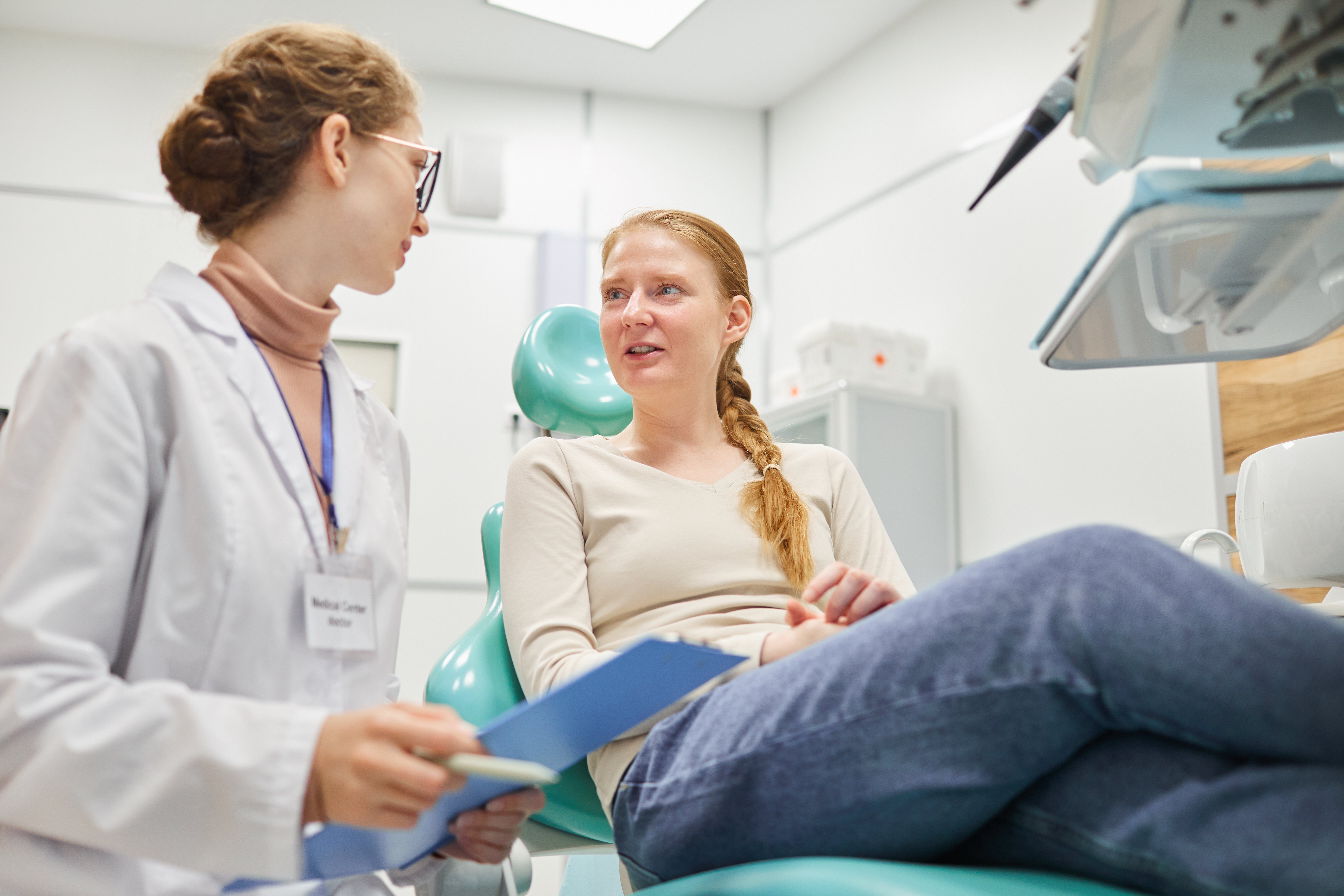 Patient discussing medical procedure with doctor — what to do after a medical diagnosis in Australia