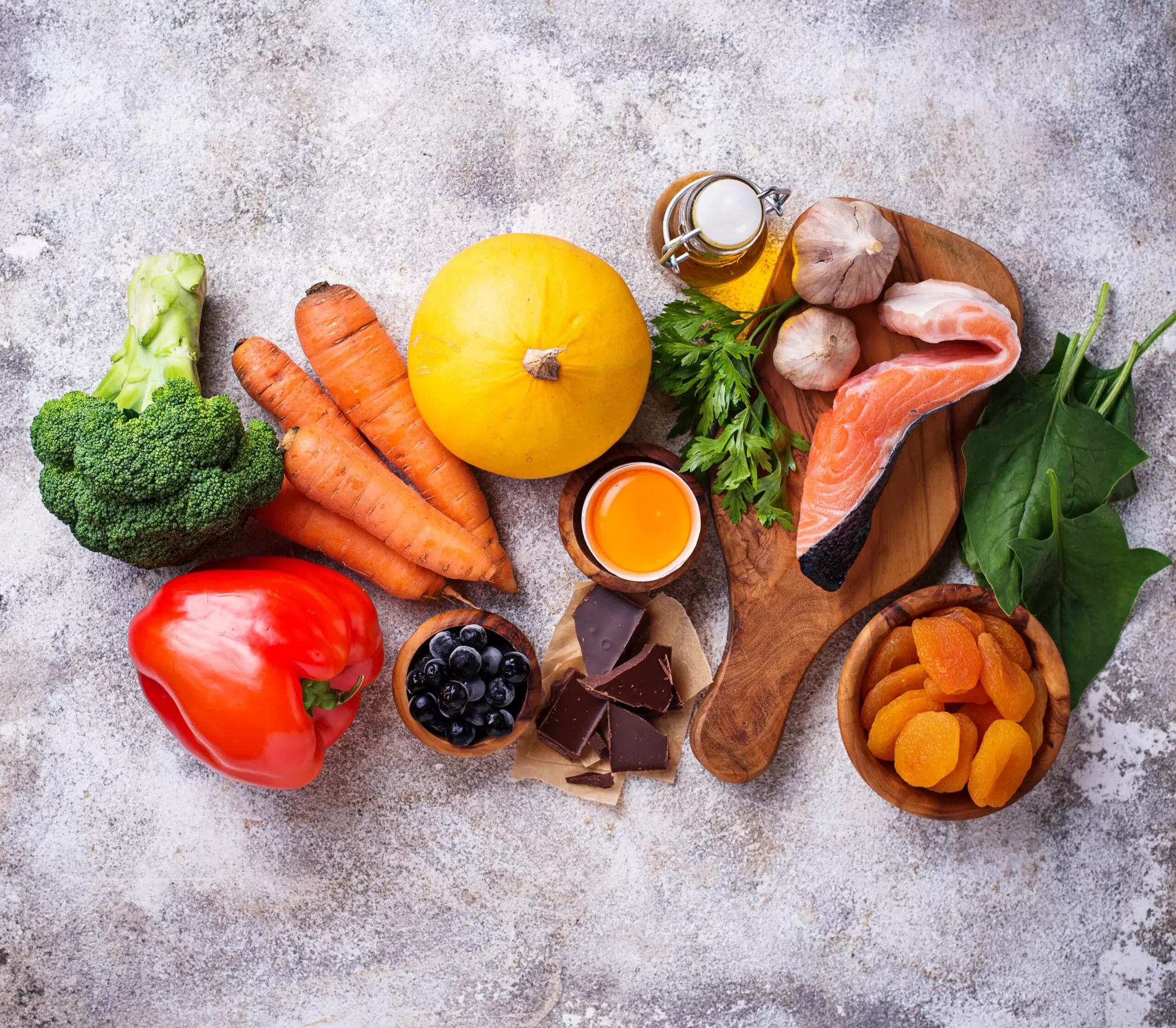 Healthy foods including berries, greens, eggs — diet supports chronic condition management