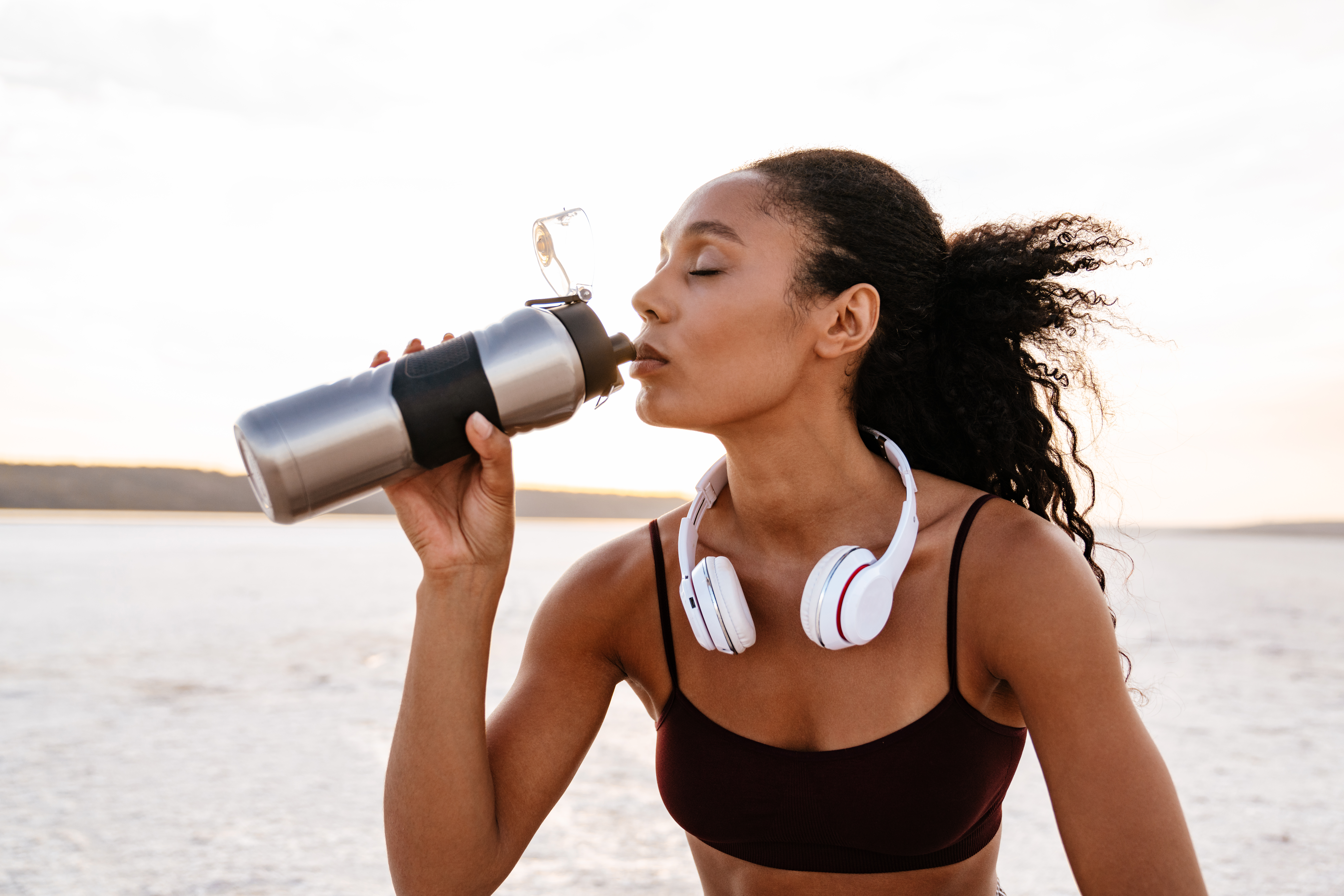 Active woman staying healthy with exercise and hydration in modern life