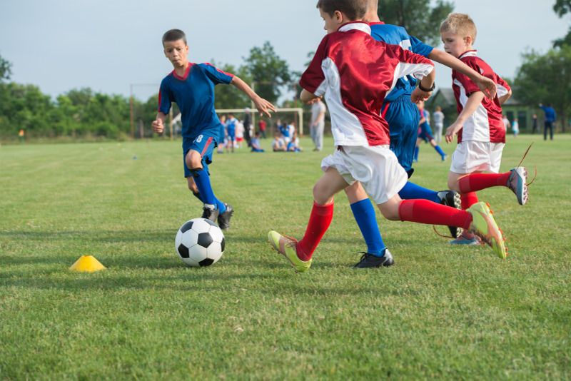 Kids playing soccer — sport safety and concussion awareness for families