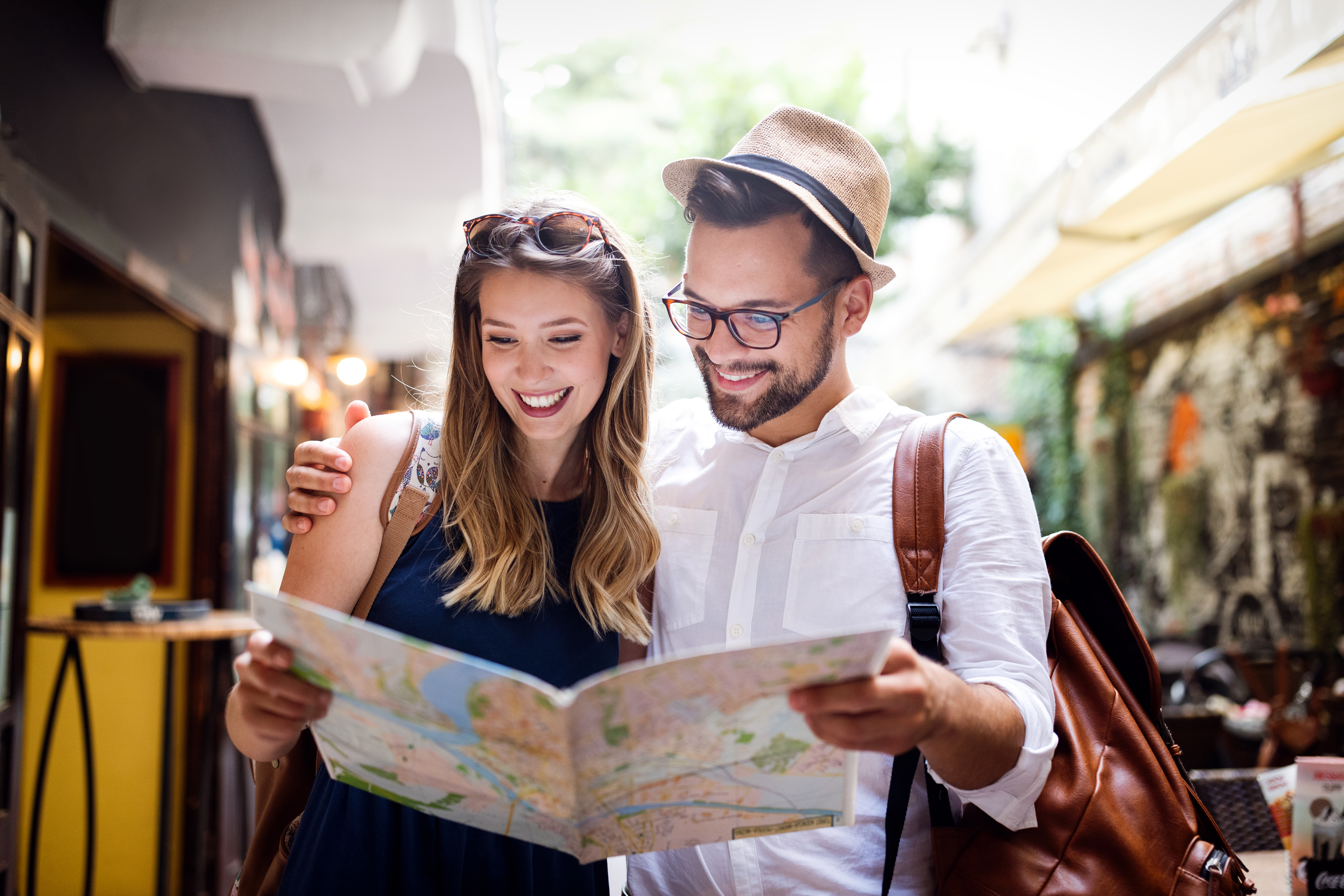 Tourist couple travelling overseas — wearing medical alert bracelets for safety while abroad