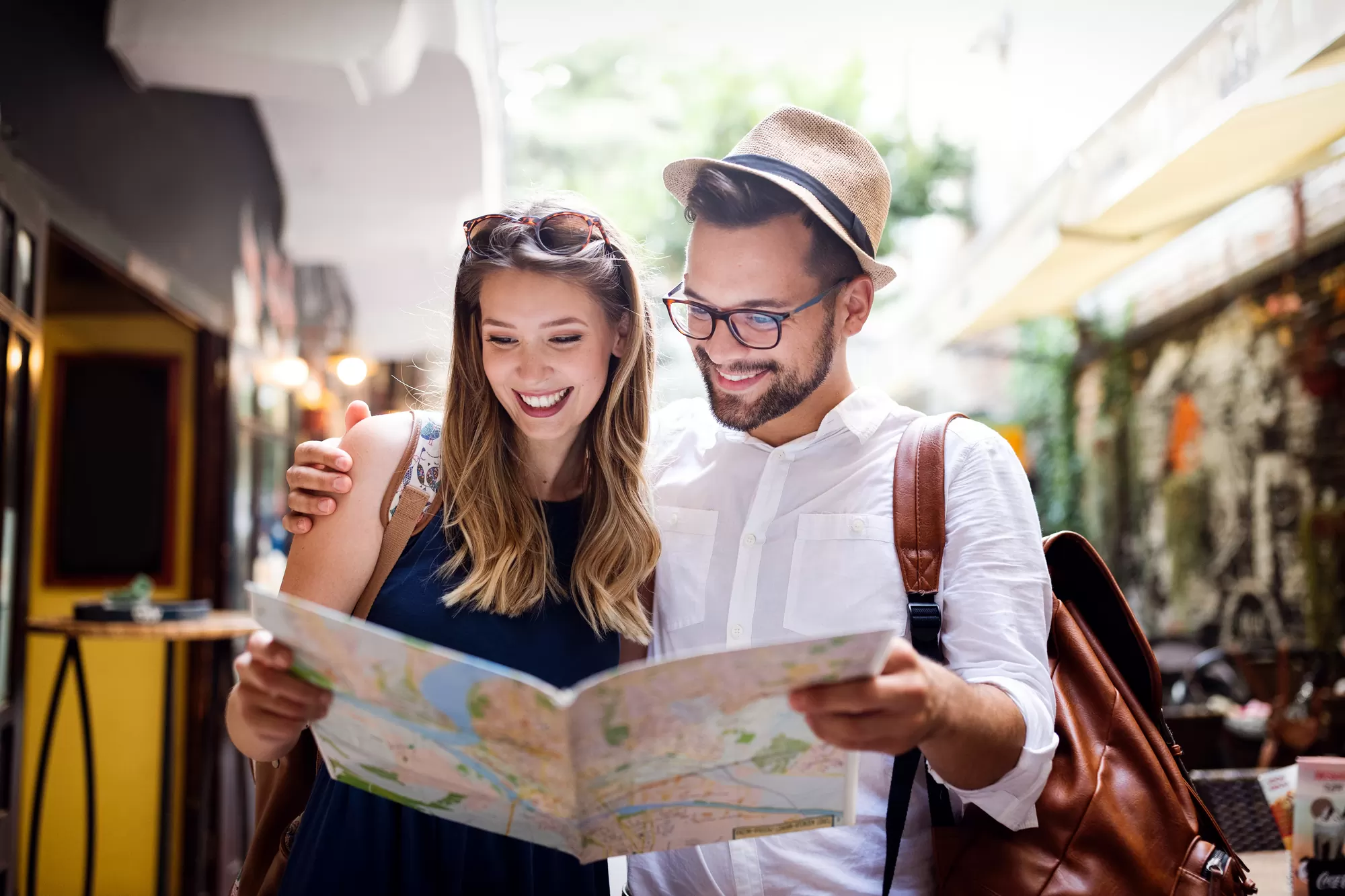 Tourist couple travelling overseas — wearing medical alert bracelets for safety while abroad