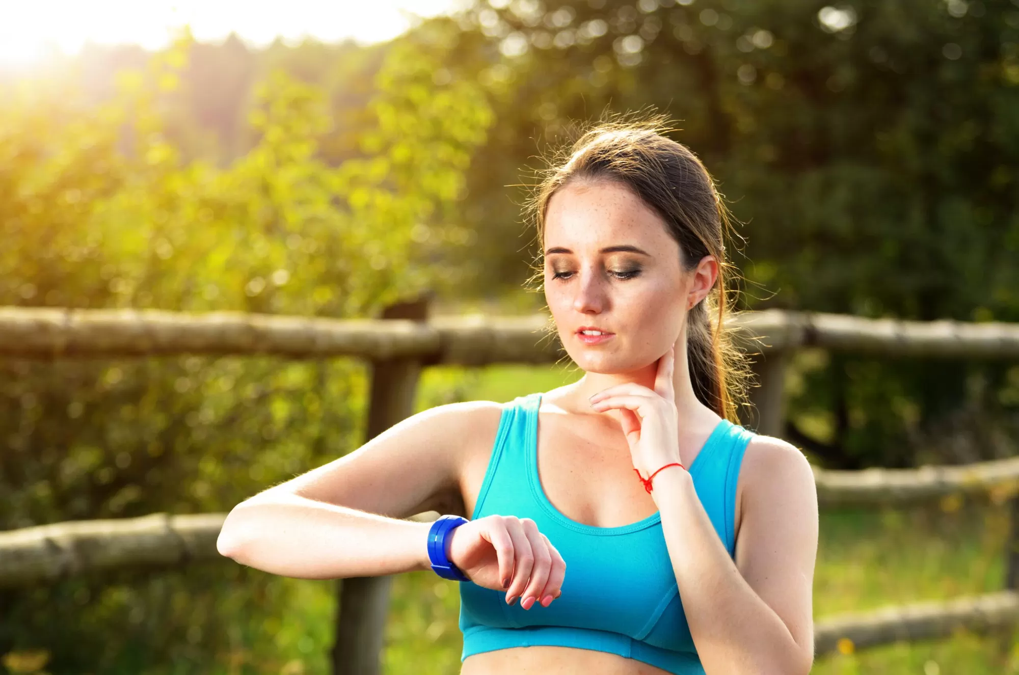 Person wearing a medical alert bracelet for chronic conditions